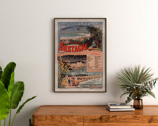 Vintage Brittany – Beaches of Brittany, railways, poster framed above a wooden dresser between plants.