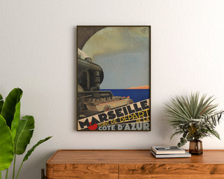 Vintage Marseille – Côte d’Azur – Roger Broders poster, framed above a wooden sideboard between plants.