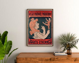 Vintage poster “À la France moderne, Lyon” framed above a wooden dresser, flanked by plants.