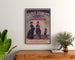 Vintage advertisement Galeries sedanaises, Nouveautés, framed above a wooden dresser between plants.