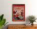 Cartel publicitario vintage Grandes Galeries modernes, Agen, enmarcado sobre una cómoda de madera, entre plantas.
