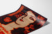 Póster publicitario vintage Perfumes Griet, presentado sobre una hoja curvada, visto en perspectiva.