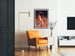 Vintage tourist poster – Grottes de Lacave, Rocamadour framed in a living room with an orange armchair and a floor lamp.