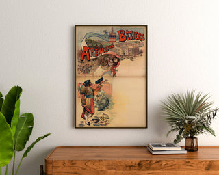 Vintage Béziers Arenas poster, framed above a wooden chest, between plants.