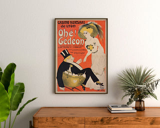 Vintage Casino Kursaal “Ohé Gédéon” poster, framed above a wooden dresser, between plants.