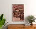 Póster vintage Dauphiné, excursiones PLM, enmarcado sobre una cómoda de madera, entre plantas.