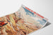 Vintage Gavarnie Chemin de fer d’Orléans poster, presented on a curled sheet, seen in perspective.