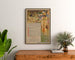 Vintage Marseille poster, Fêtes du Centenaire, framed above a wooden dresser between plants.