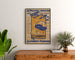 Vintage aviation meeting poster, Clermont-Ferrand, framed above a wooden dresser, between plants.