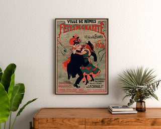 Vintage Nîmes poster, charity festivities, framed above a wooden chest, between plants.