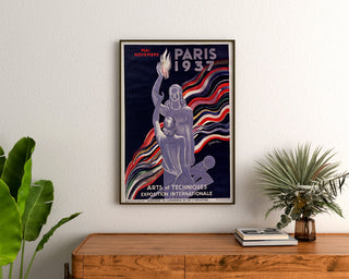 Vintage Paris poster 1937, Arts and Techniques, framed above a wooden dresser, between plants.