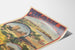 Vintage Pyrénées et Gascogne winter poster, presented on a curled sheet, seen in perspective.