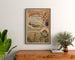 Vintage Touraine poster, Garden of France, framed above a wooden dresser between plants.