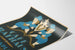 Close view of the Café Rathaus poster, blue figures on black