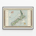 Antique map of New Zealand – MacDonald Gill, 1931, shown in a slim frame on a light wall.