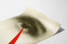 Artistic poster of an eye and a decorative red arrow
