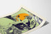 Vintage poster of Queen City Printing Ink Company in shades of orange, blue, and green